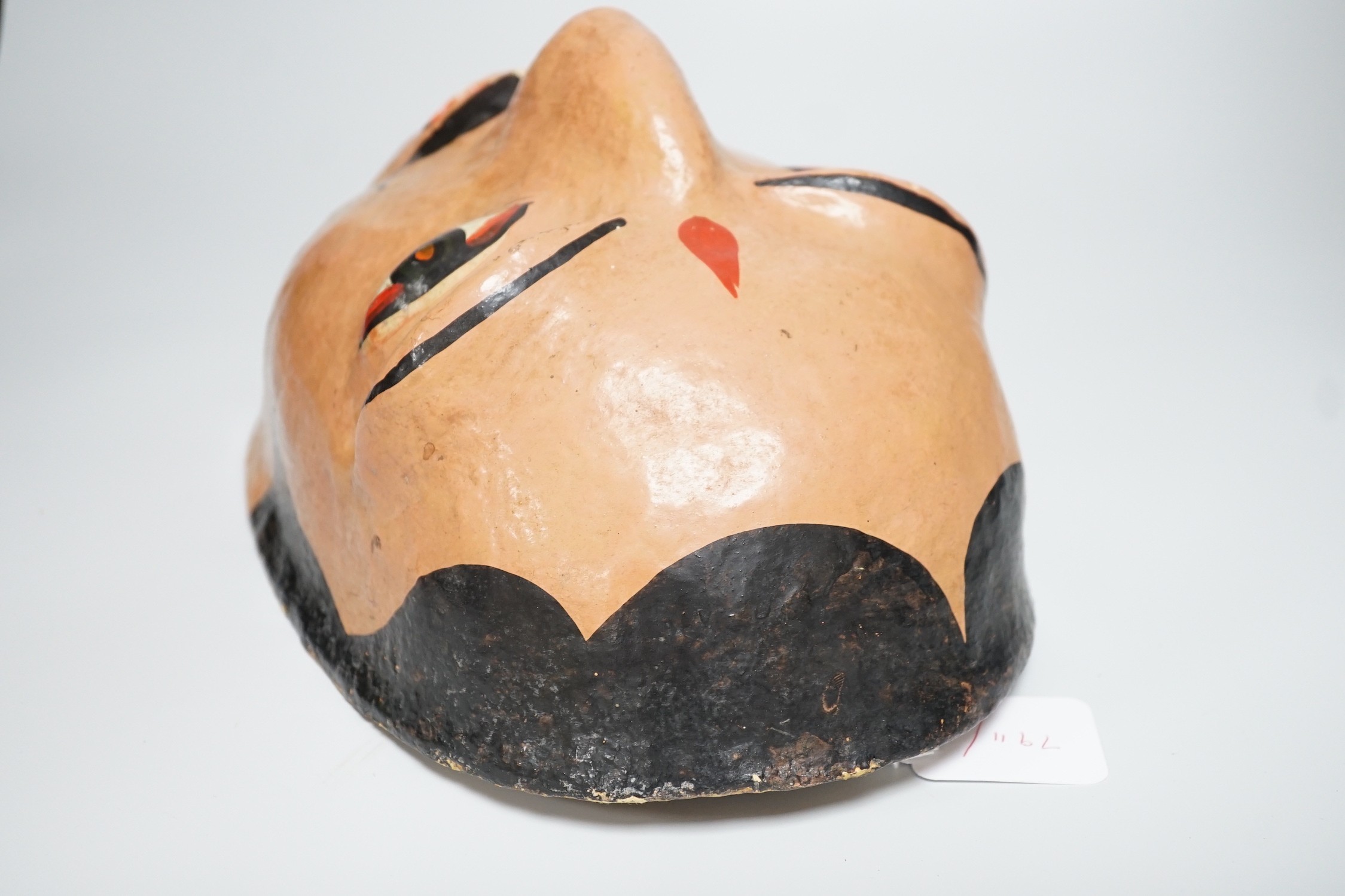 A papier mache wall mask of an Indian gentleman 32cm long